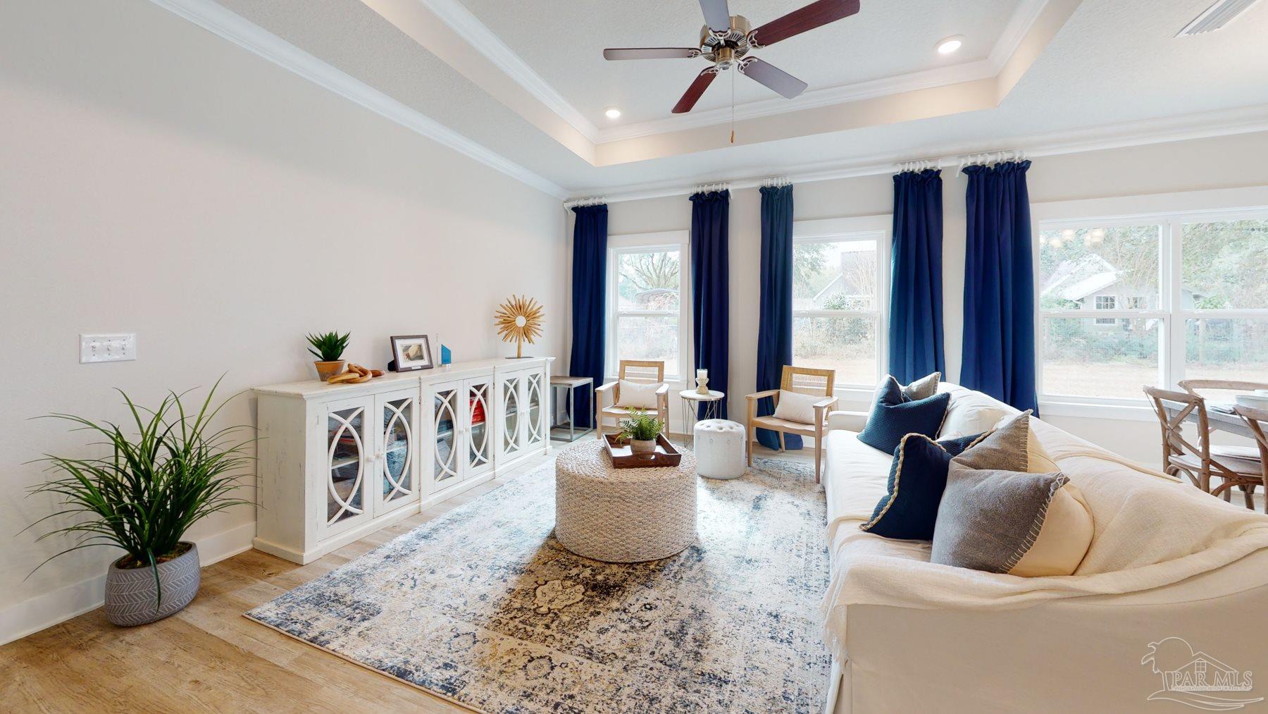 4531 Jude Way Pace, FL 32571 - Photo 6 of 43 a living room with furniture and large windows