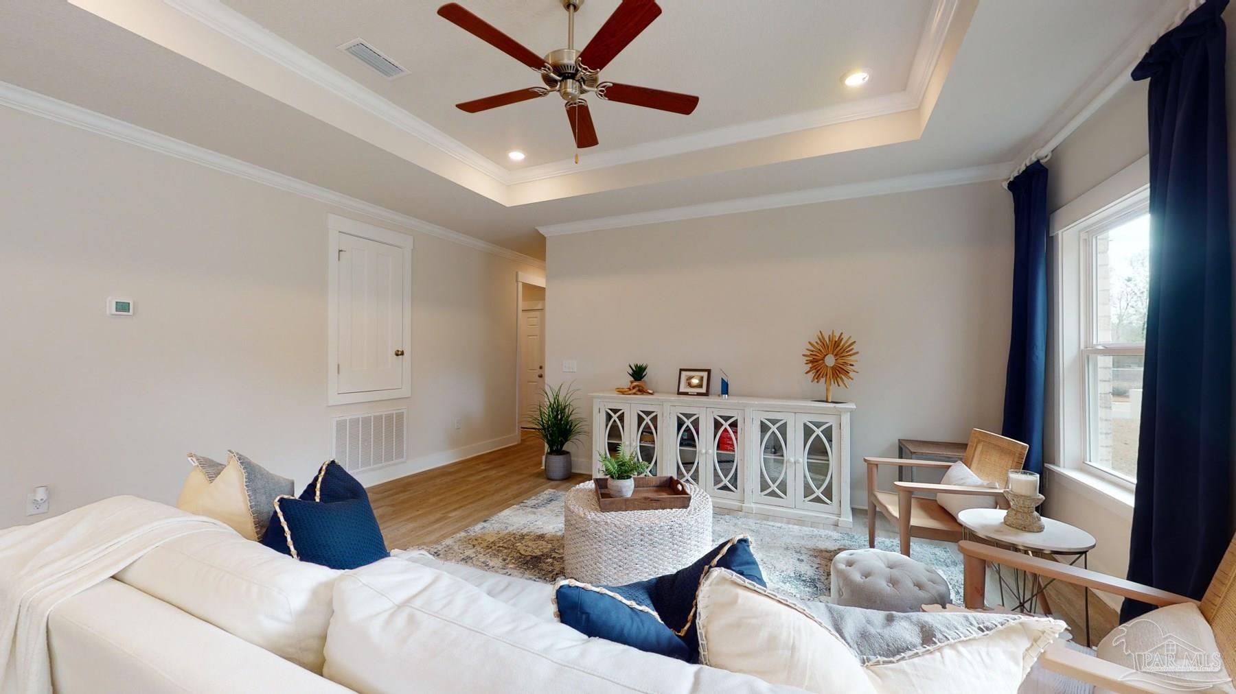 4531 Jude Way Pace, FL 32571 - Photo 7 of 43 a bedroom with a bed a couch and a window