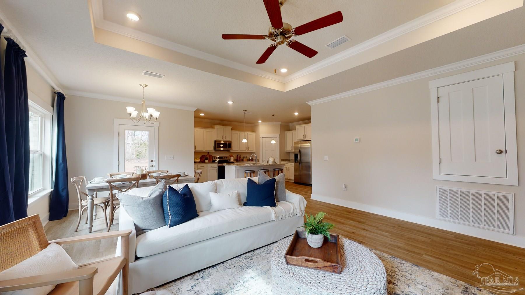 4531 Jude Way Pace, FL 32571 - Photo 8 of 43 a living room with furniture and a wooden floor