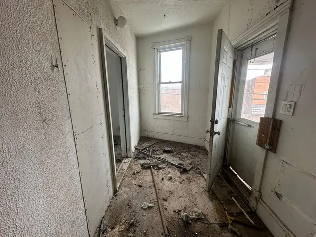 a backyard of a house with a table and chairs