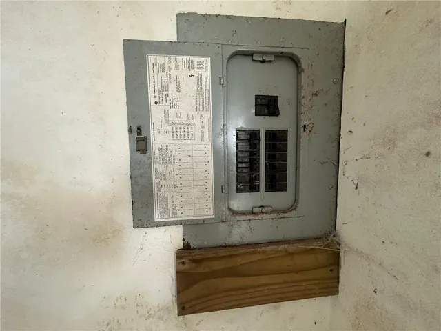 a view of a hallway with a chandelier