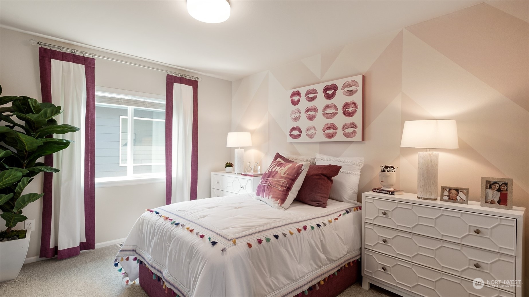 3933 233rd Street Southeast, Unit 2 Bothell, WA 98021 - Photo 12 of 18 a bedroom with a large bed and a potted plant