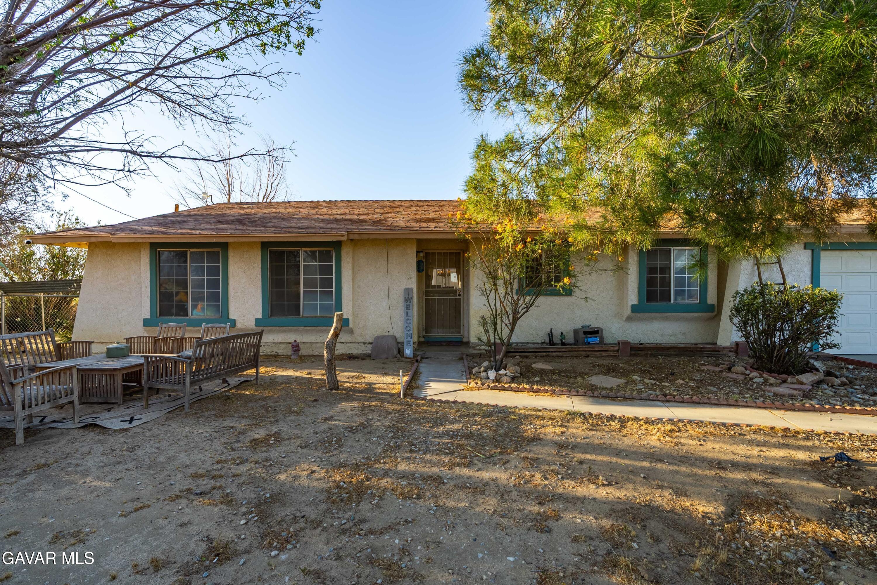 20539 East Ave R Palmdale, CA 93591 - Photo 9 of 55 a view of a house with backyard