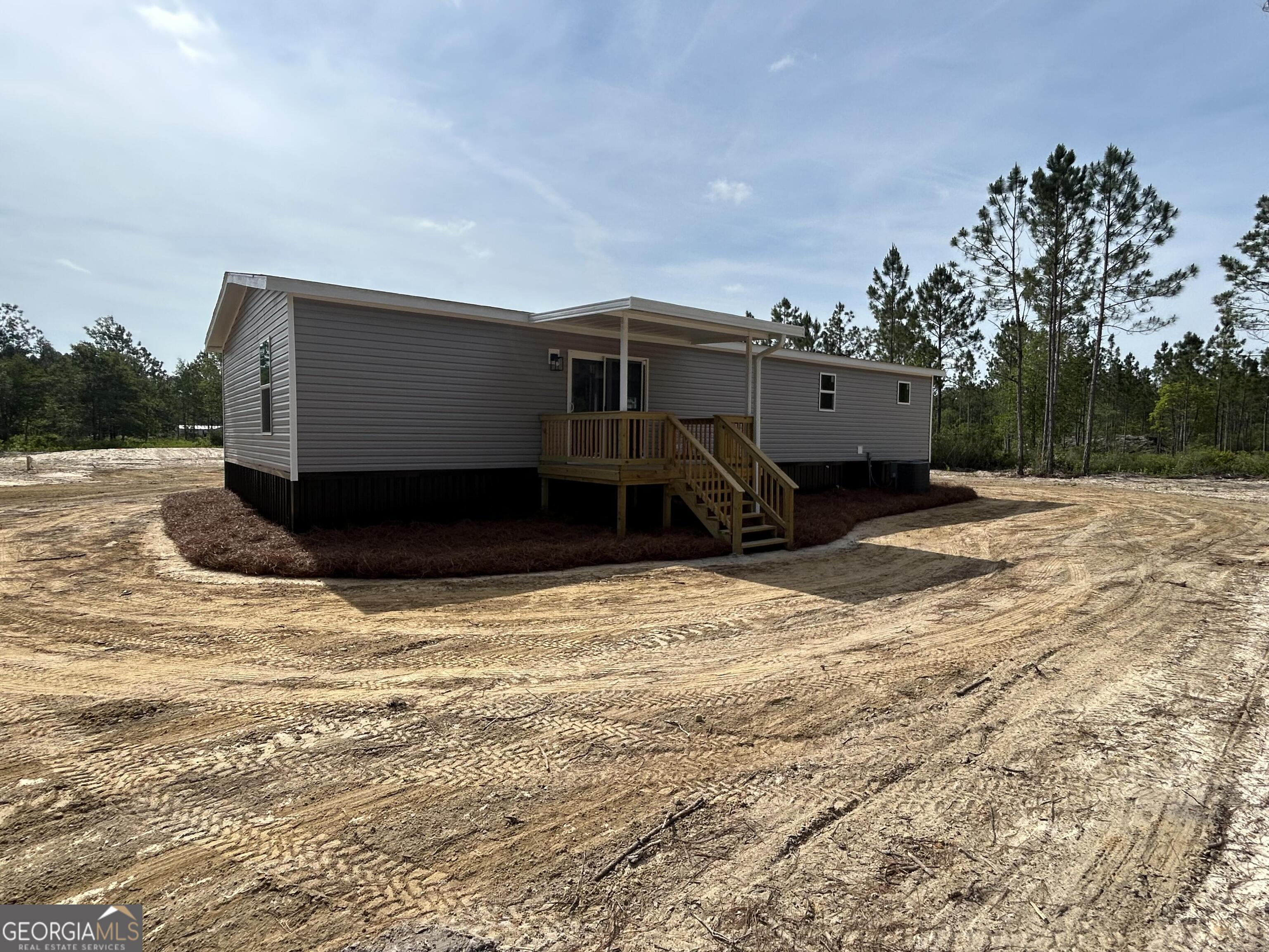 640 Elmer Thrift Road Waycross, GA 31503 - Photo 5 of 23 a front view of a house with a yard