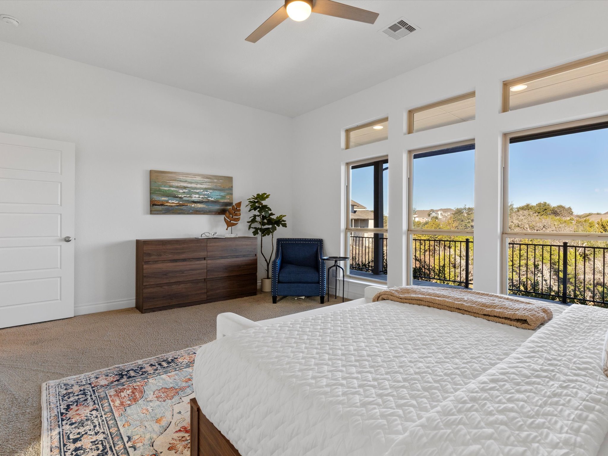 1009 Deer Rim Road Leander, TX 78641 - Photo 12 of 40 The primary suite is secluded away at the back of the home, where you can relax and take in the greenbelt views from the comfort of your bed.