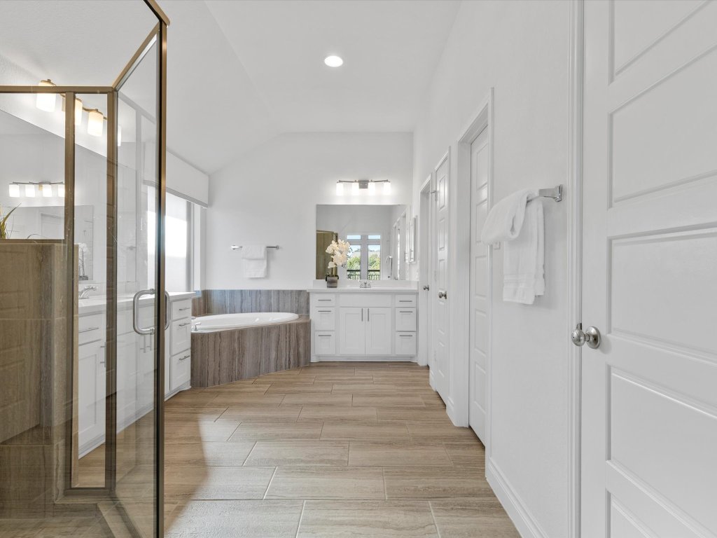 1009 Deer Rim Road Leander, TX 78641 - Photo 14 of 40 Double doors open into your own private spa-like ensuite bathroom.