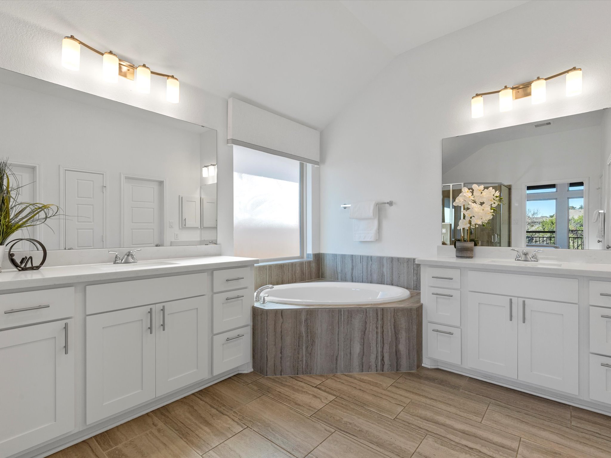 1009 Deer Rim Road Leander, TX 78641 - Photo 16 of 40 Featuring separate vanities with timeless Shaker-style cabinetry, which are well complimented by the stylish modern finishes.