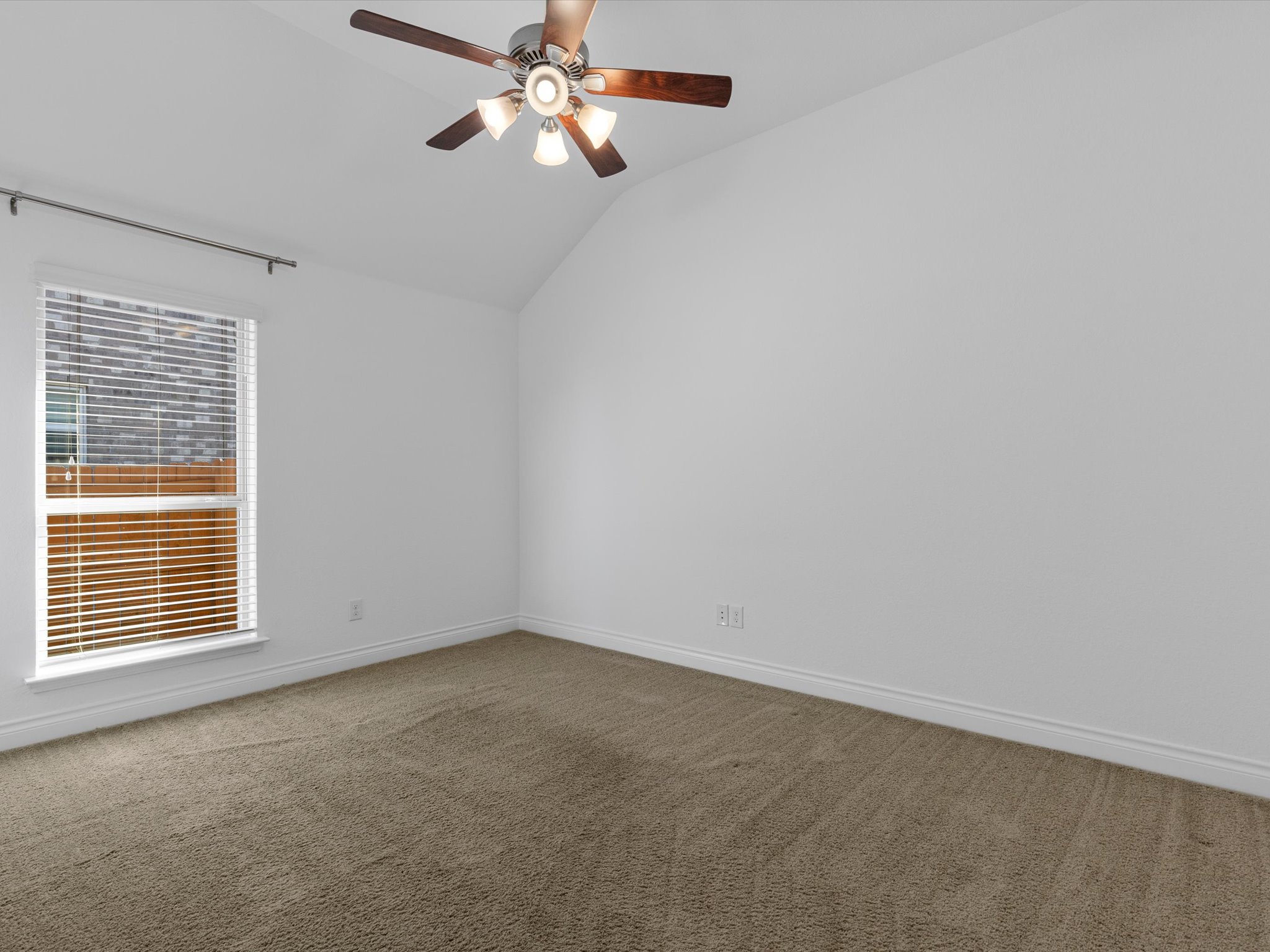 1009 Deer Rim Road Leander, TX 78641 - Photo 24 of 40 All of the secondary bedrooms come with tall ceilings, overhead fans, walk-in closets, and carpeting.