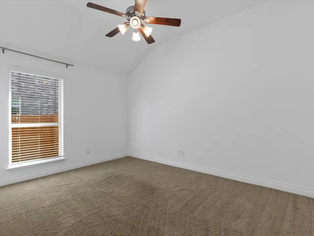 a bathroom with a sink a toilet a mirror and shower