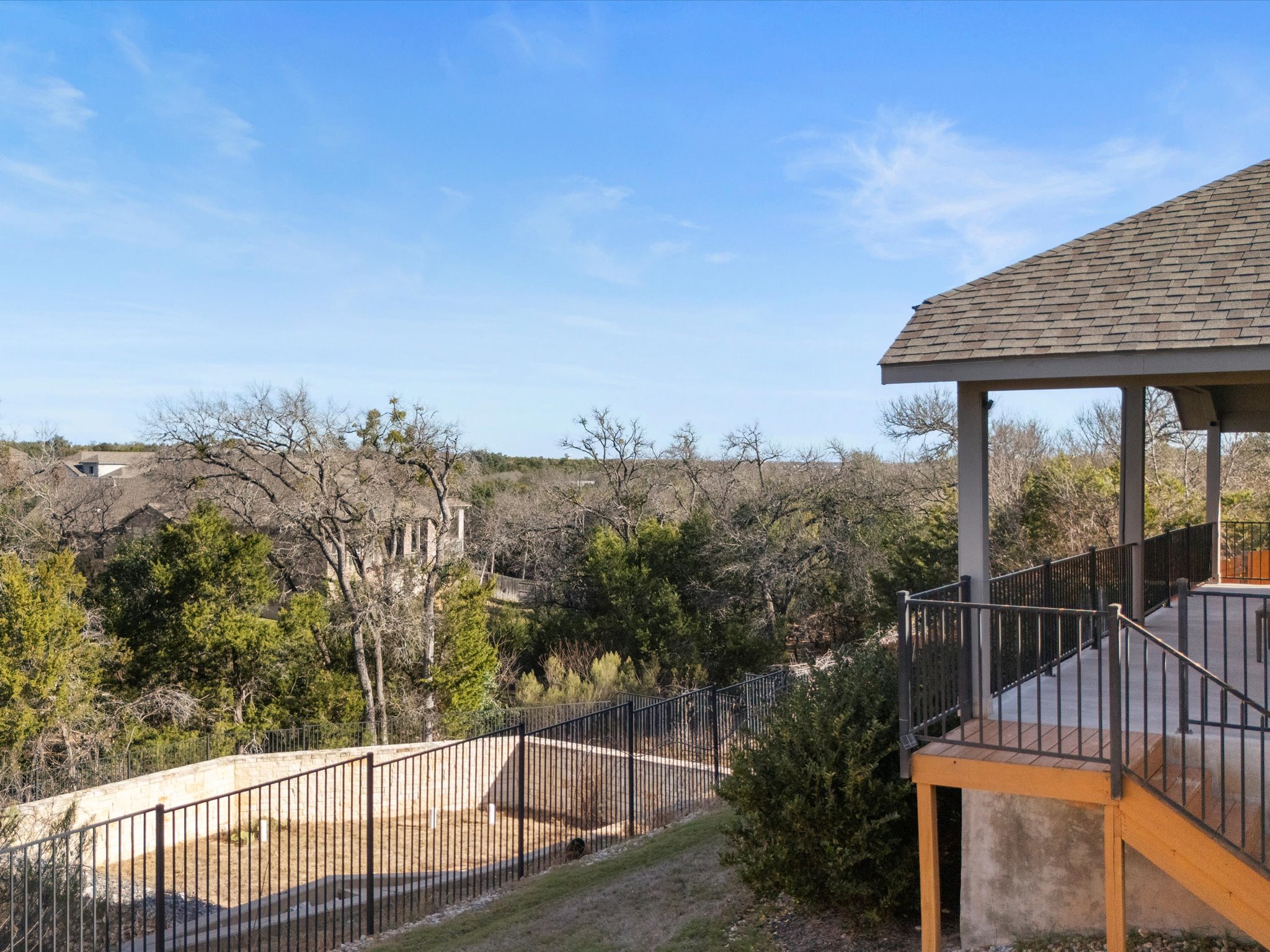 1009 Deer Rim Road Leander, TX 78641 - Photo 30 of 40 Wrought iron fencing along the back side of the yard preserves the views of the greenbelt beyond.