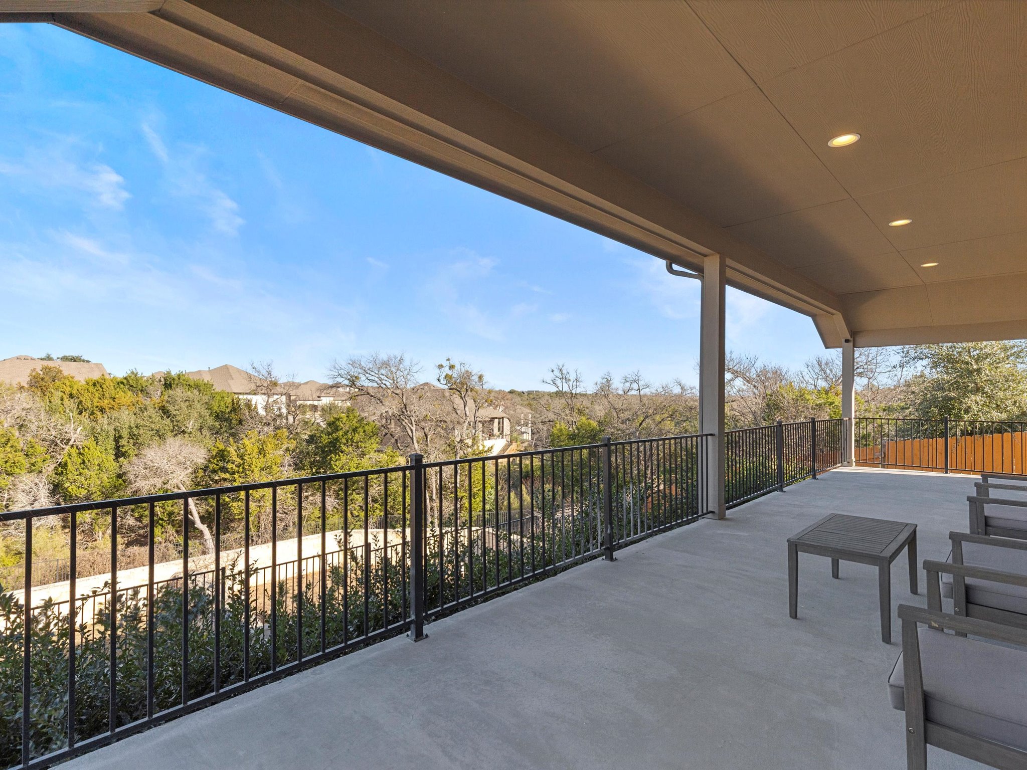 1009 Deer Rim Road Leander, TX 78641 - Photo 7 of 40 Your living space extends outdoors onto this sprawling entertainer's porch where you can kick back, relax, and take in the majestic views.
