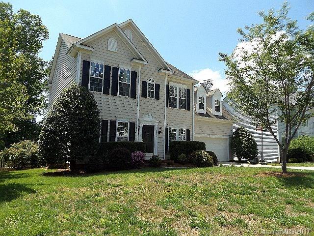 1033 Kilpatrick Lane Fort Mill, SC 29708 - Photo 1 of 24 a front view of a house with a garden