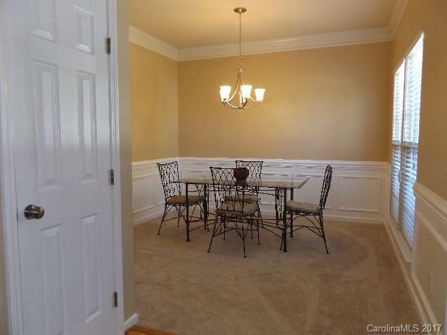 1033 Kilpatrick Lane Fort Mill, SC 29708 - Photo 2 of 24 a view of a dining room with furniture and window