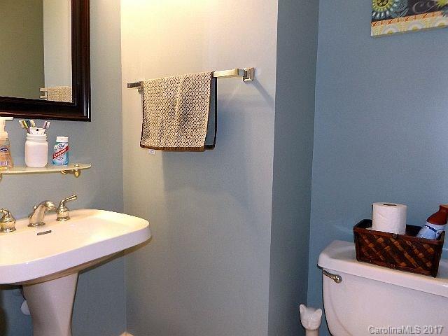 1033 Kilpatrick Lane Fort Mill, SC 29708 - Photo 11 of 24 a bathroom with a sink a toilet and mirror