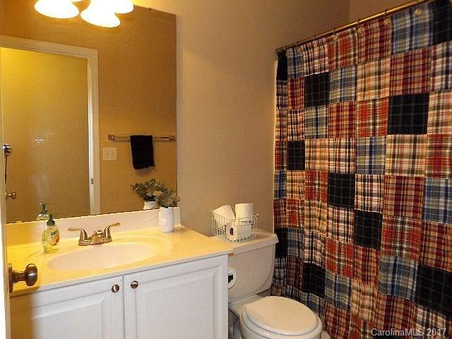 1033 Kilpatrick Lane Fort Mill, SC 29708 - Photo 17 of 24 a bathroom with a sink toilet vanity and shower