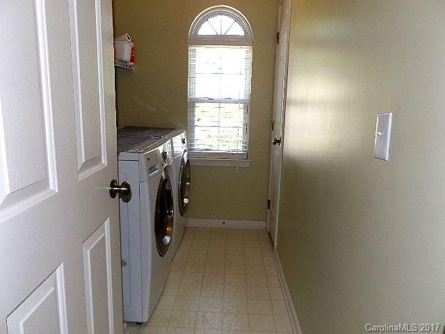 1033 Kilpatrick Lane Fort Mill, SC 29708 - Photo 20 of 24 a view of an entryway with a washer and dryer