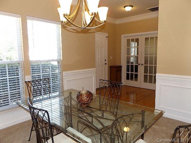 1033 Kilpatrick Lane Fort Mill, SC 29708 - Photo 3 of 24 a view of a dining room with furniture and wooden floor