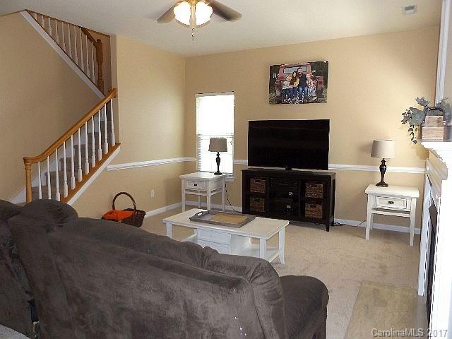 1033 Kilpatrick Lane Fort Mill, SC 29708 - Photo 8 of 24 a living room with furniture and a flat screen tv