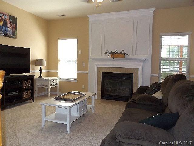 1033 Kilpatrick Lane Fort Mill, SC 29708 - Photo 9 of 24 a living room with furniture and a fireplace