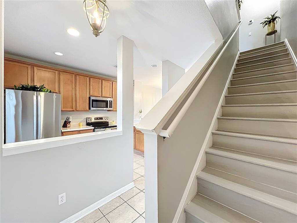 3309 Wilshire Way Road, Unit 3 Orlando, FL 32829 - Photo 17 of 43 a view of kitchen with microwave and refrigerator
