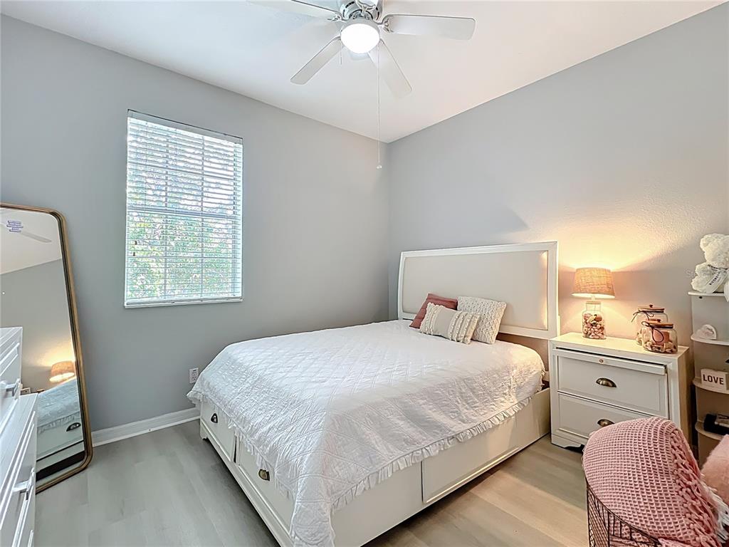 3309 Wilshire Way Road, Unit 3 Orlando, FL 32829 - Photo 18 of 43 a bedroom with a bed and a flat tv screen on dresser