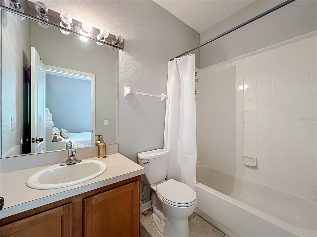 3309 Wilshire Way Road, Unit 3 Orlando, FL 32829 - Photo 19 of 43 a bathroom with a sink toilet and shower