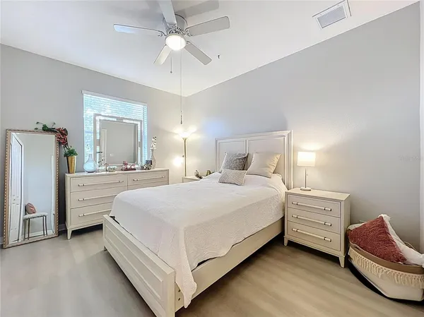 a bedroom with a bed and a dresser