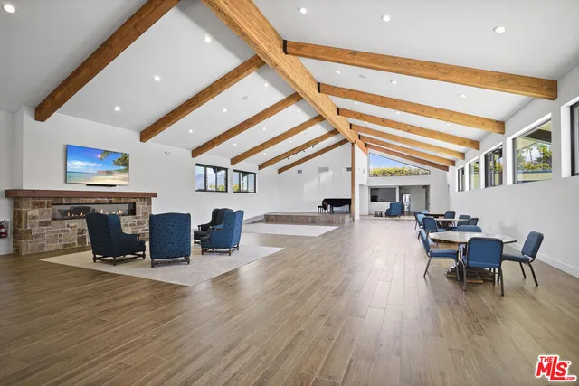 a dining room with furniture and wooden floor