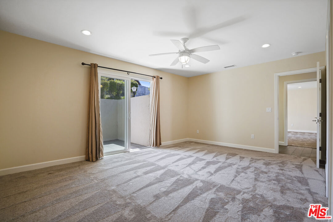 29500 Heathercliff Road, Unit A Malibu, CA 90265 - Photo 8 of 21 an empty room with fan and entrance