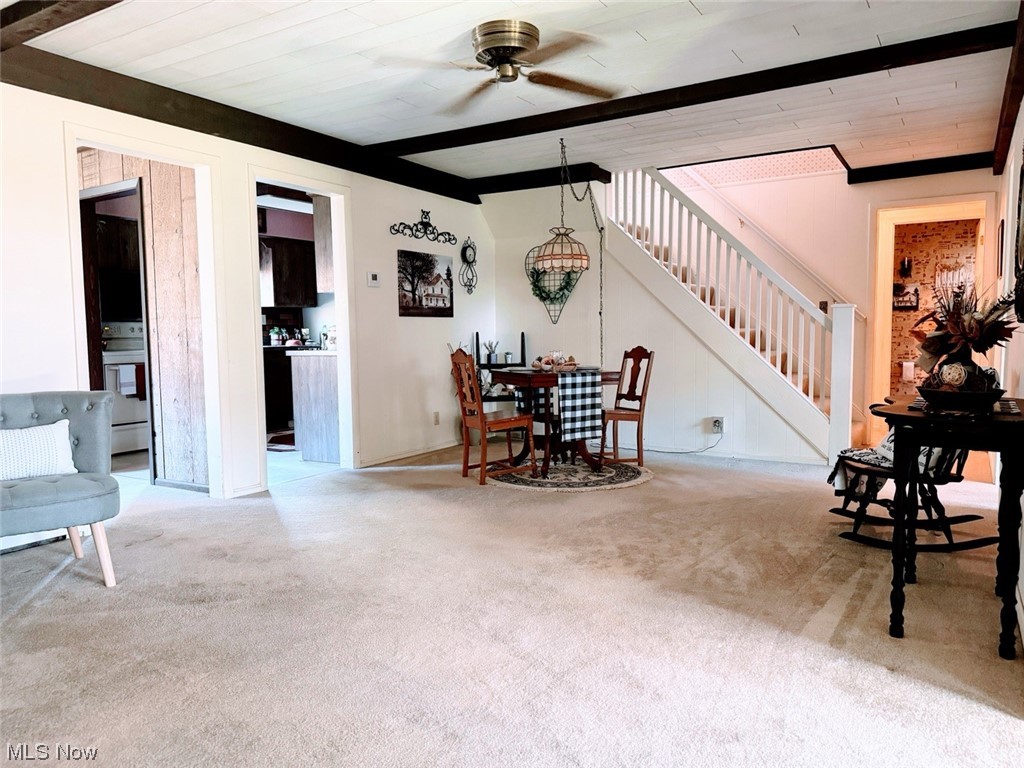 1639 Stonehaven Road Madison, OH 44057 - Photo 22 of 35 Dining area with ceiling fan, wooden ceiling, light carpet, and beam ceiling