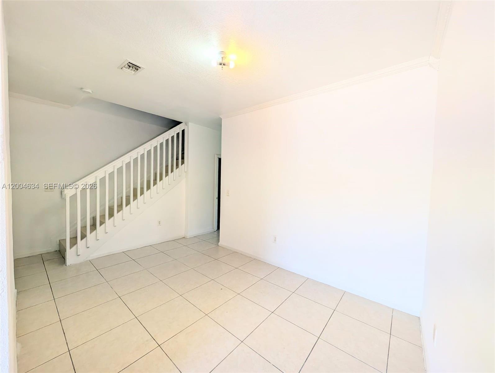 12080 Southwest 268th Street, Unit 27 Homestead, FL 33032 - Photo 2 of 6 a view of an entryway with a window