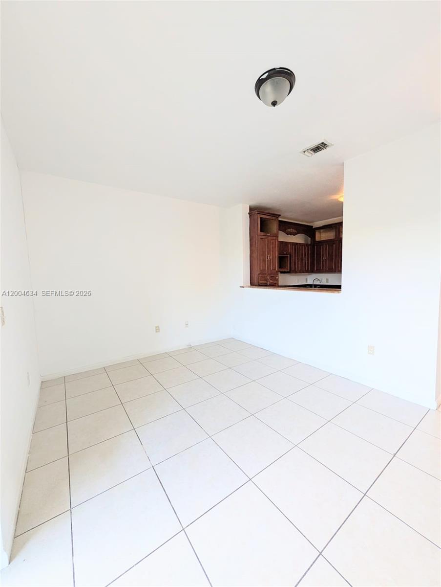12080 Southwest 268th Street, Unit 27 Homestead, FL 33032 - Photo 4 of 6 a view of a room with an oven
