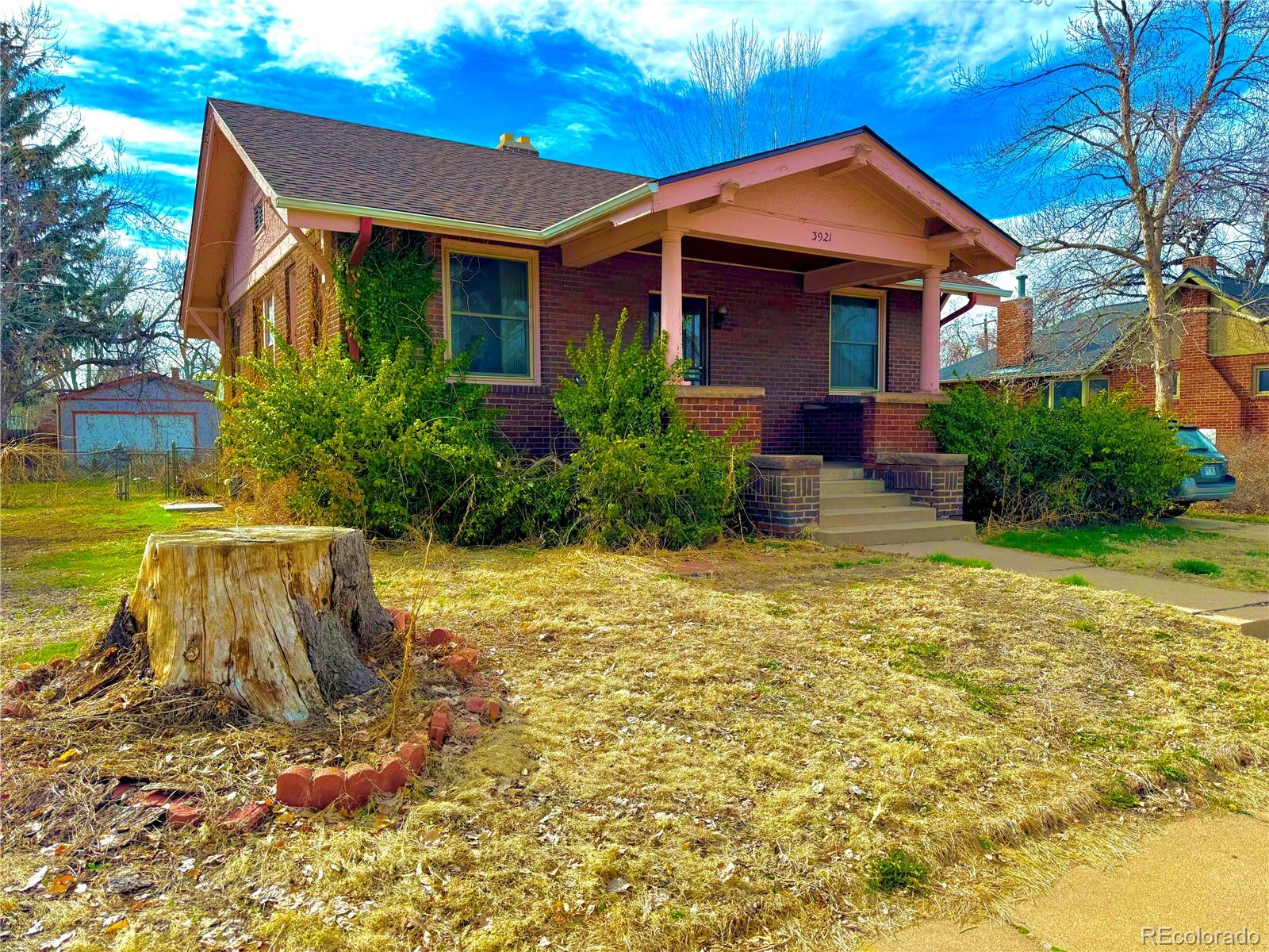 3921 Meade Street Denver, CO 80211 - Photo 1 of 27 a front view of a house with a yard