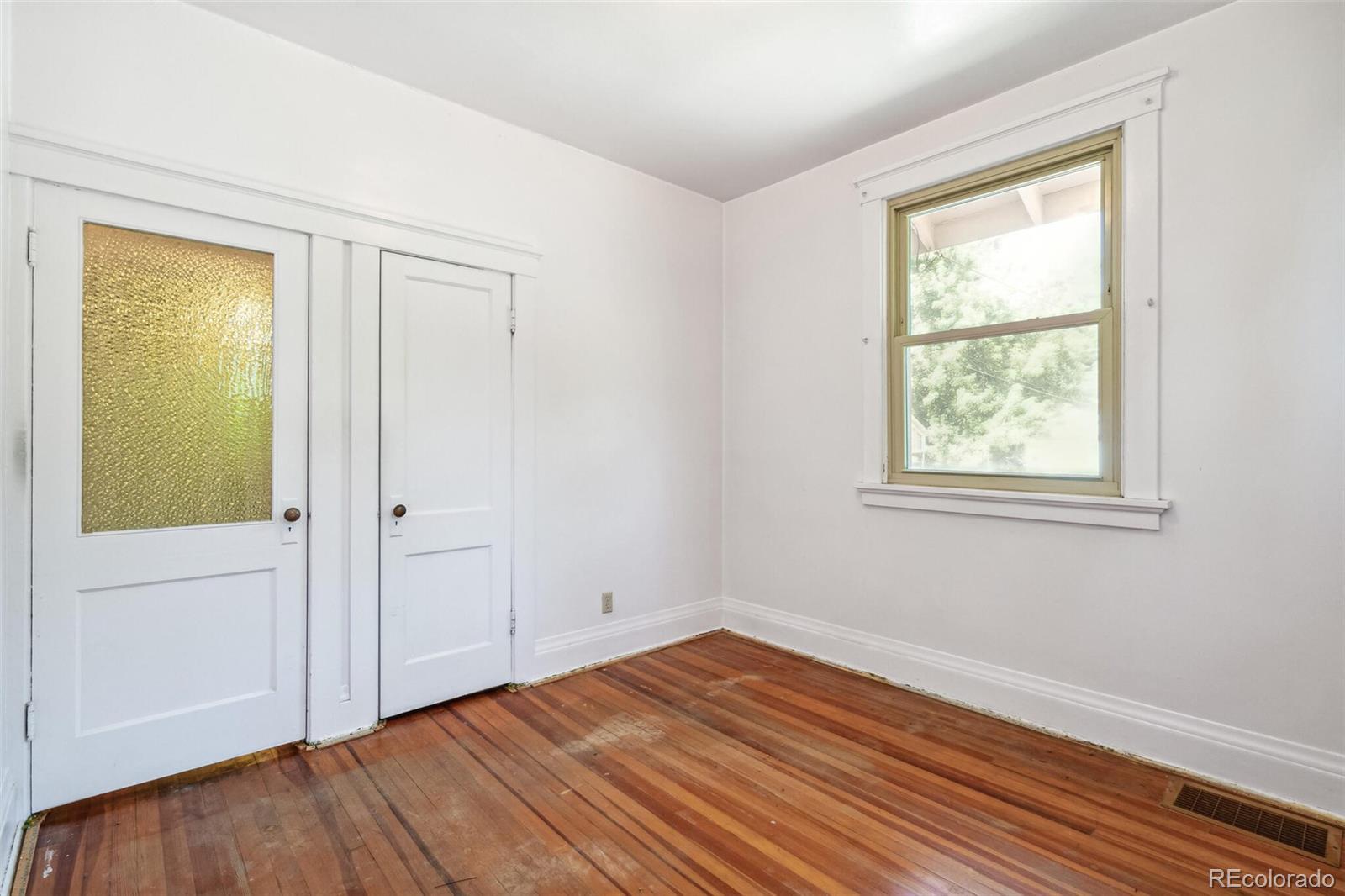 3921 Meade Street Denver, CO 80211 - Photo 20 of 27 a view of empty room with wooden floor and fan