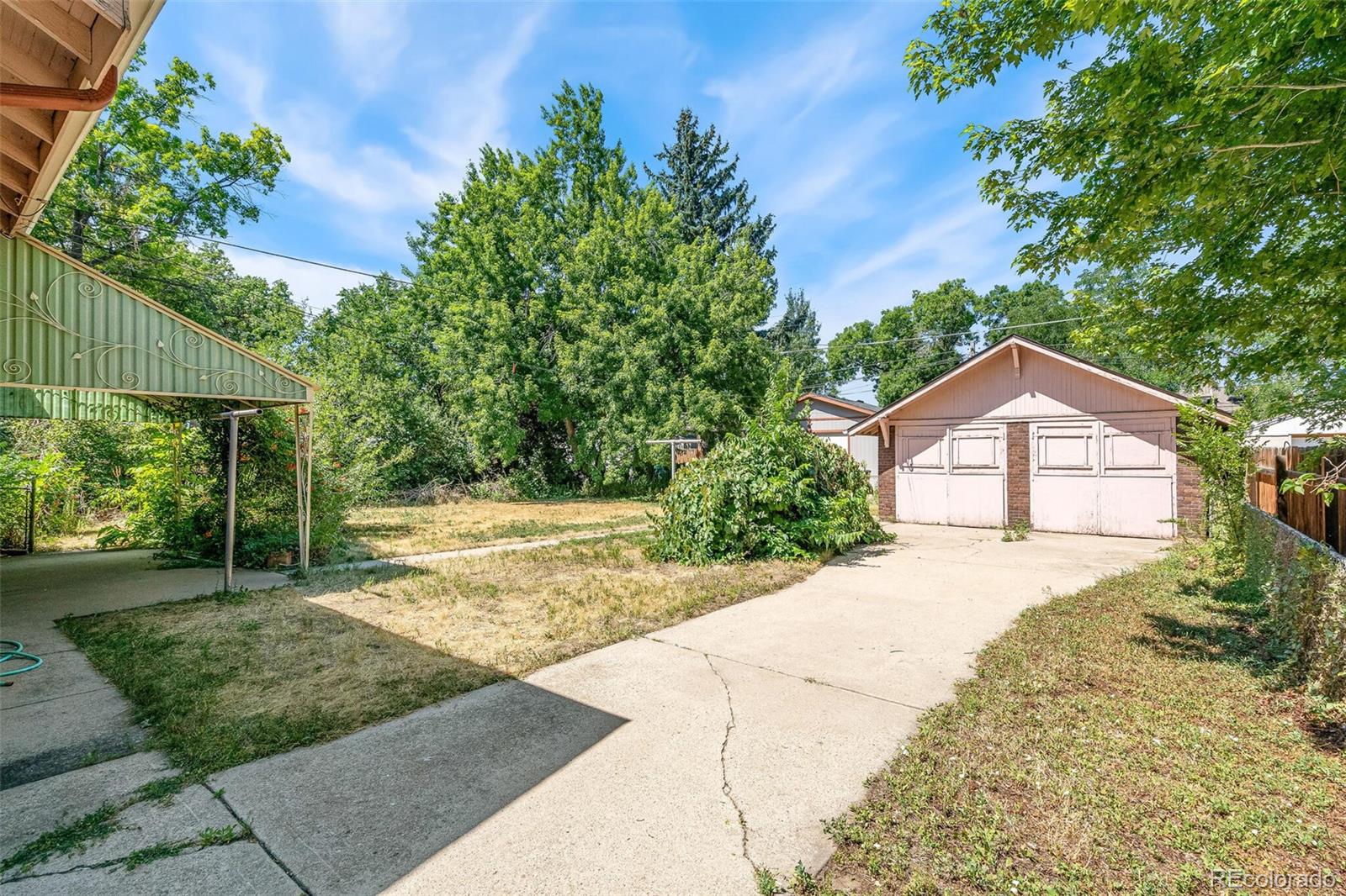 3921 Meade Street Denver, CO 80211 - Photo 22 of 27 a view of a house with a yard and large tree