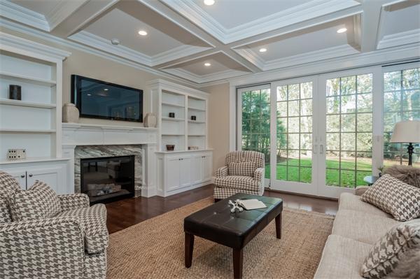 49 Westgate Road Newton, MA 02459 - Photo 13 of 27 a living room with furniture a flat screen tv and a fireplace