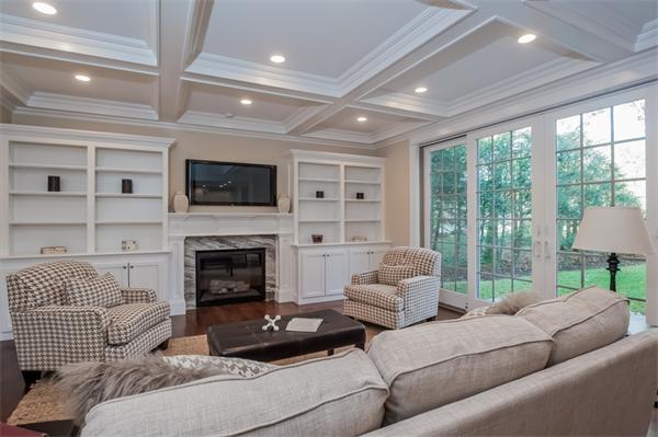 49 Westgate Road Newton, MA 02459 - Photo 14 of 27 a living room with furniture a fireplace and a flat screen tv