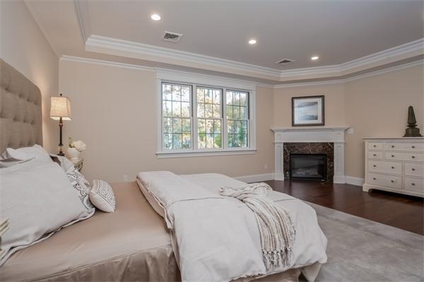 49 Westgate Road Newton, MA 02459 - Photo 18 of 27 a bedroom with a bed and a fireplace