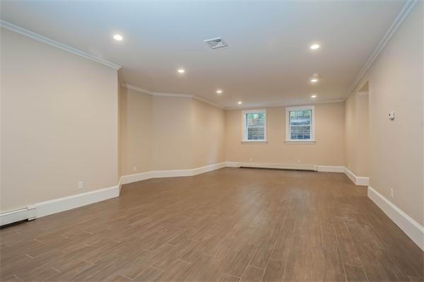 49 Westgate Road Newton, MA 02459 - Photo 22 of 27 an empty room with wooden floor and windows