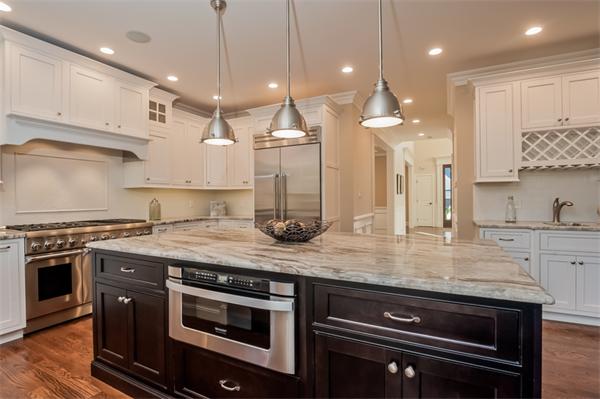 49 Westgate Road Newton, MA 02459 - Photo 10 of 27 a kitchen with stainless steel appliances granite countertop a stove a sink and a granite counter tops