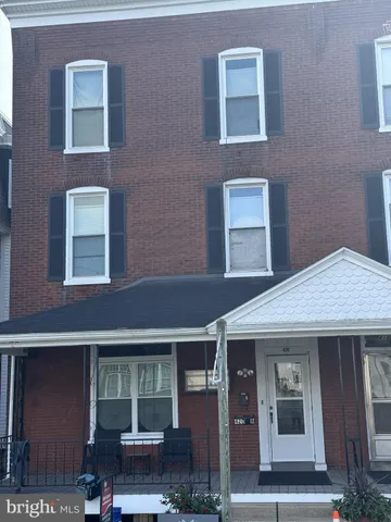 a front view of a house with outdoor space