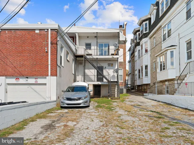 a view of a car park in front of a building