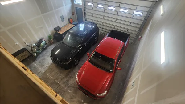 a view of a livingroom with furniture and staircase