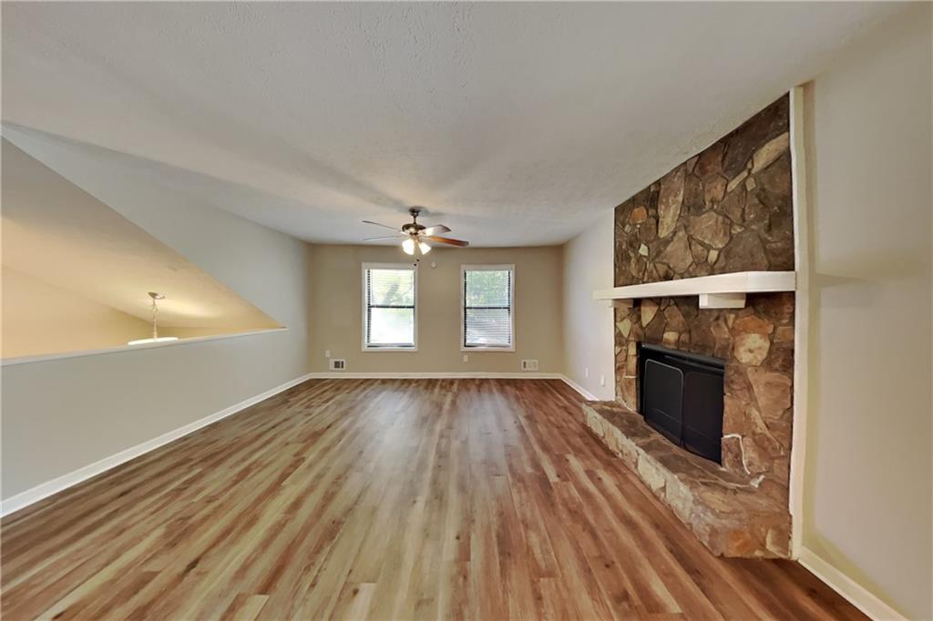 6015 Sumit Court Northwest Kennesaw, GA 30152 - Photo 3 of 24 wooden floor in an empty room with a window