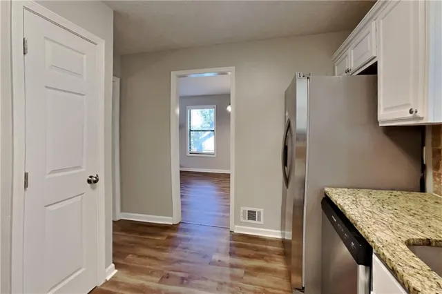 a view of kitchen island with wooden floor
