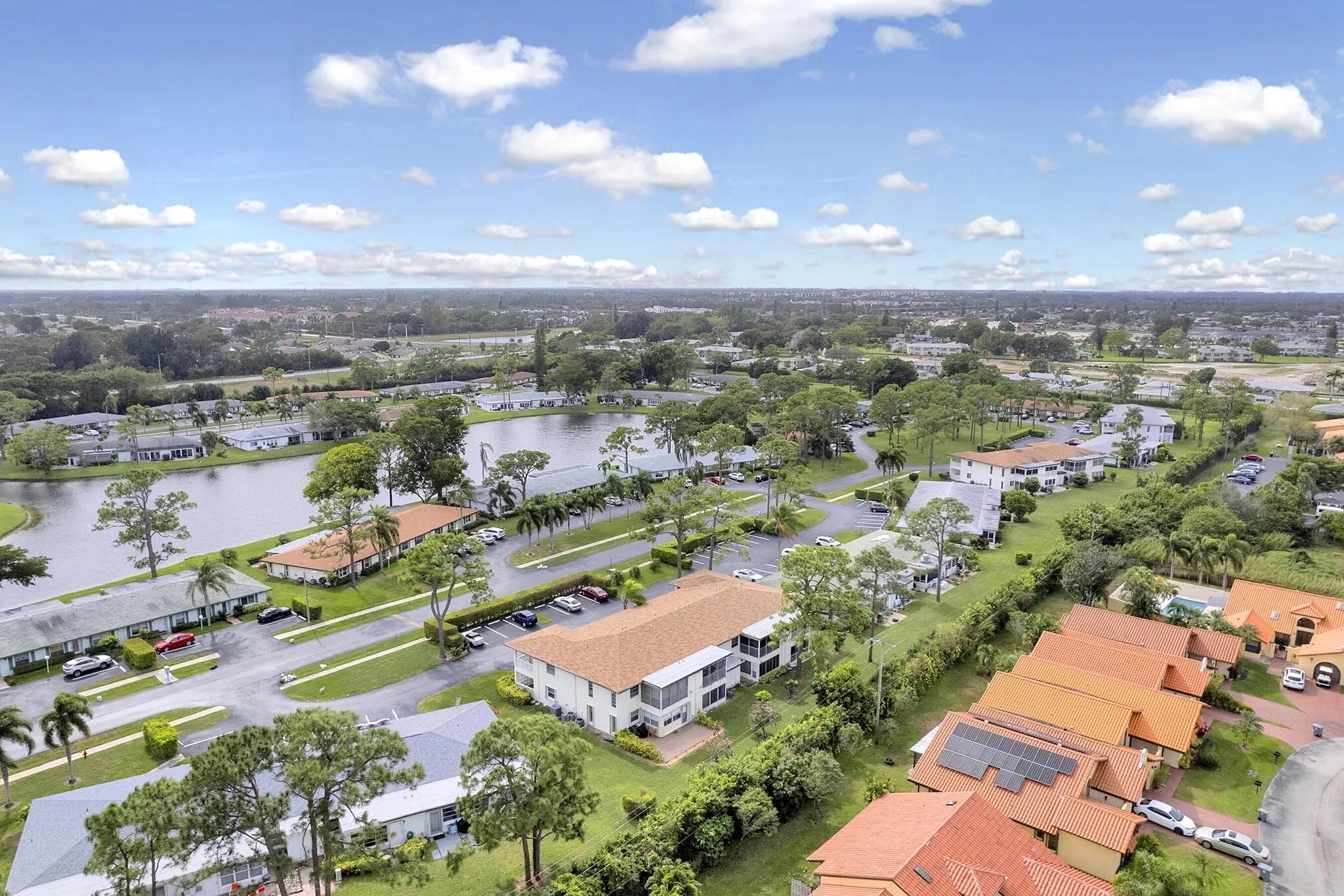 5321 Poppy Place, Unit 203 Delray Beach, FL 33484 - Photo 26 of 31 an aerial view of residential houses with outdoor space