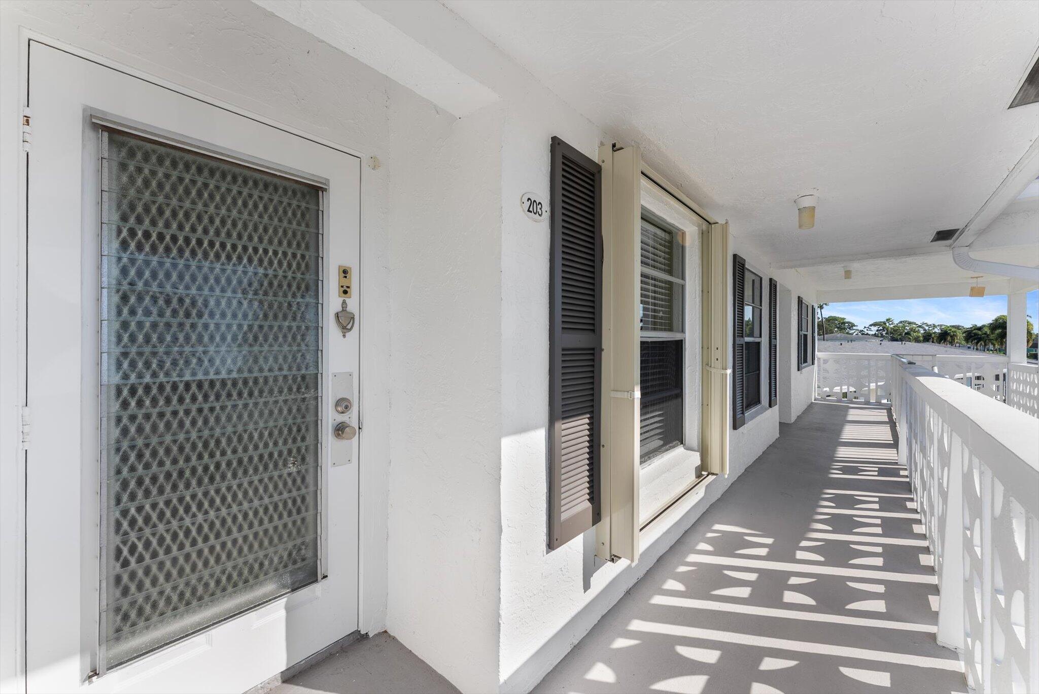 5321 Poppy Place, Unit 203 Delray Beach, FL 33484 - Photo 4 of 31 a view of a balcony