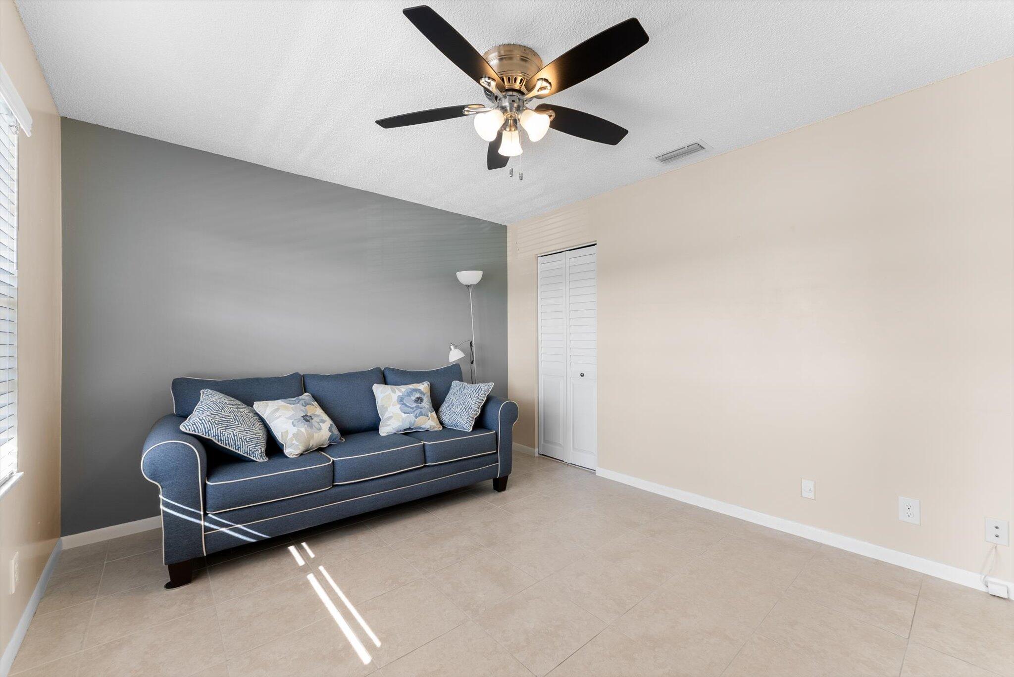 5321 Poppy Place, Unit 203 Delray Beach, FL 33484 - Photo 7 of 31 a living room with furniture