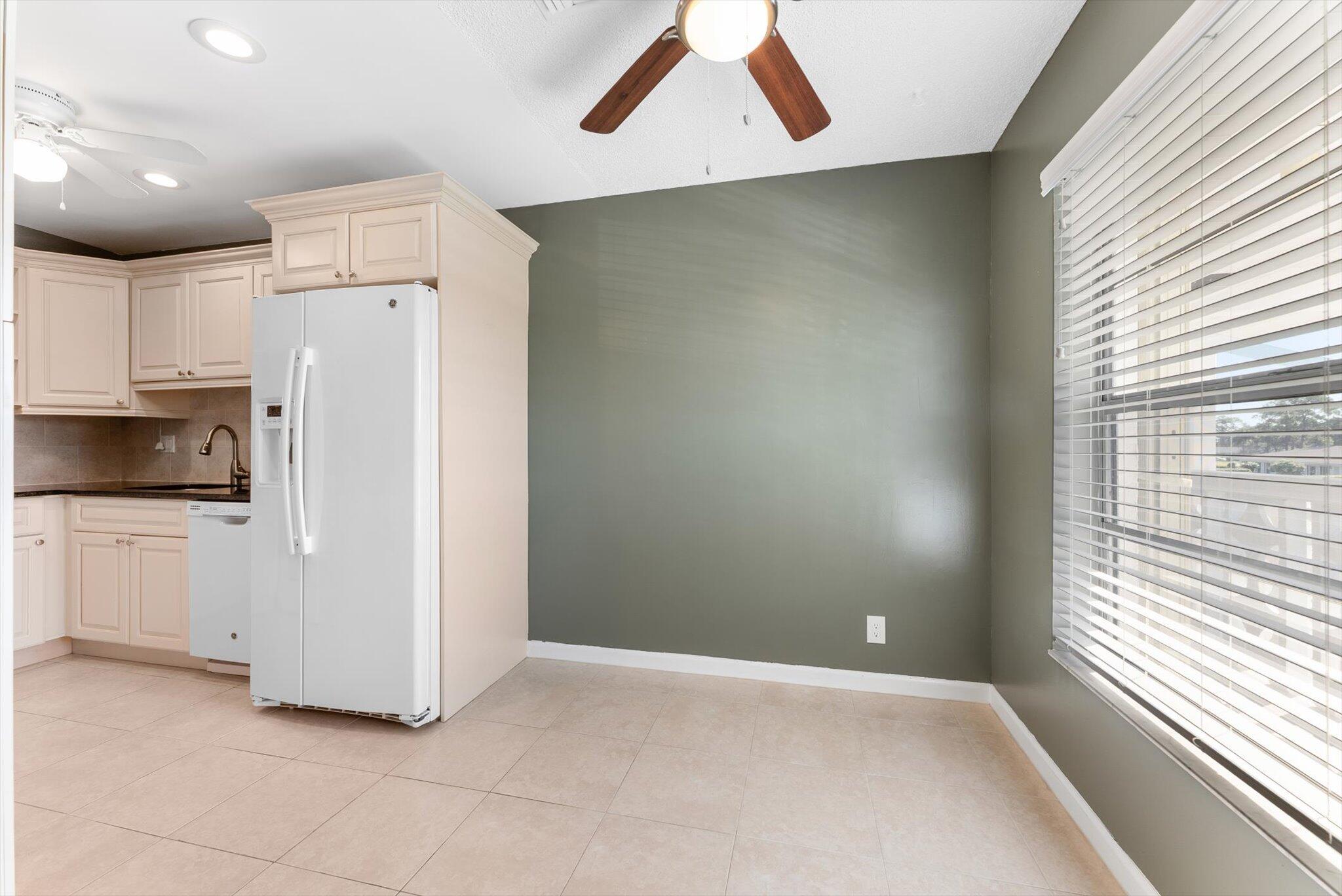 5321 Poppy Place, Unit 203 Delray Beach, FL 33484 - Photo 9 of 31 a view of a kitchen with a sink and dishwasher kitchen view
