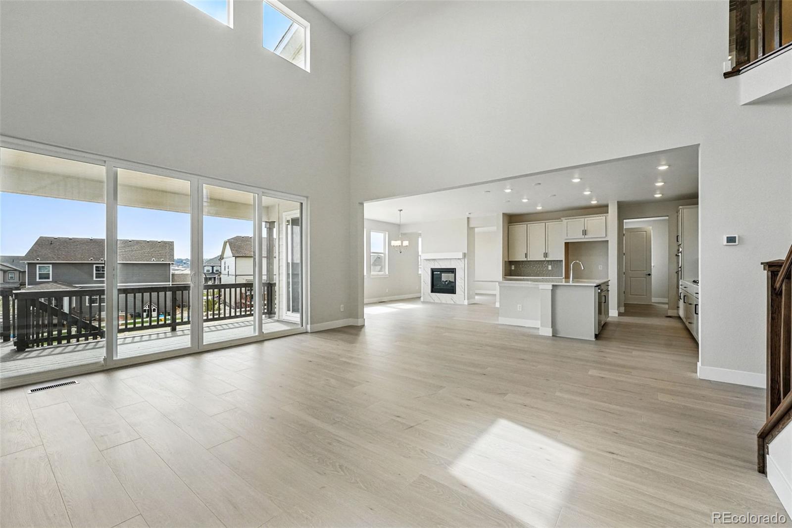5722 Farrier Point Castle Rock, CO 80104 - Photo 12 of 41 a view of an empty room with kitchen and a window